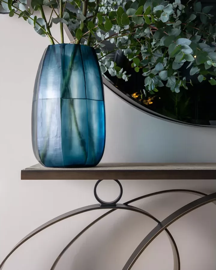 Rodin Console Table by Cantori, console table next to an Italian glass cabinet