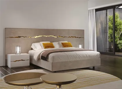 Luxury Reflex Angelo bedroom featuring an upholstered bed with refined finishes and a premium atmosphere.